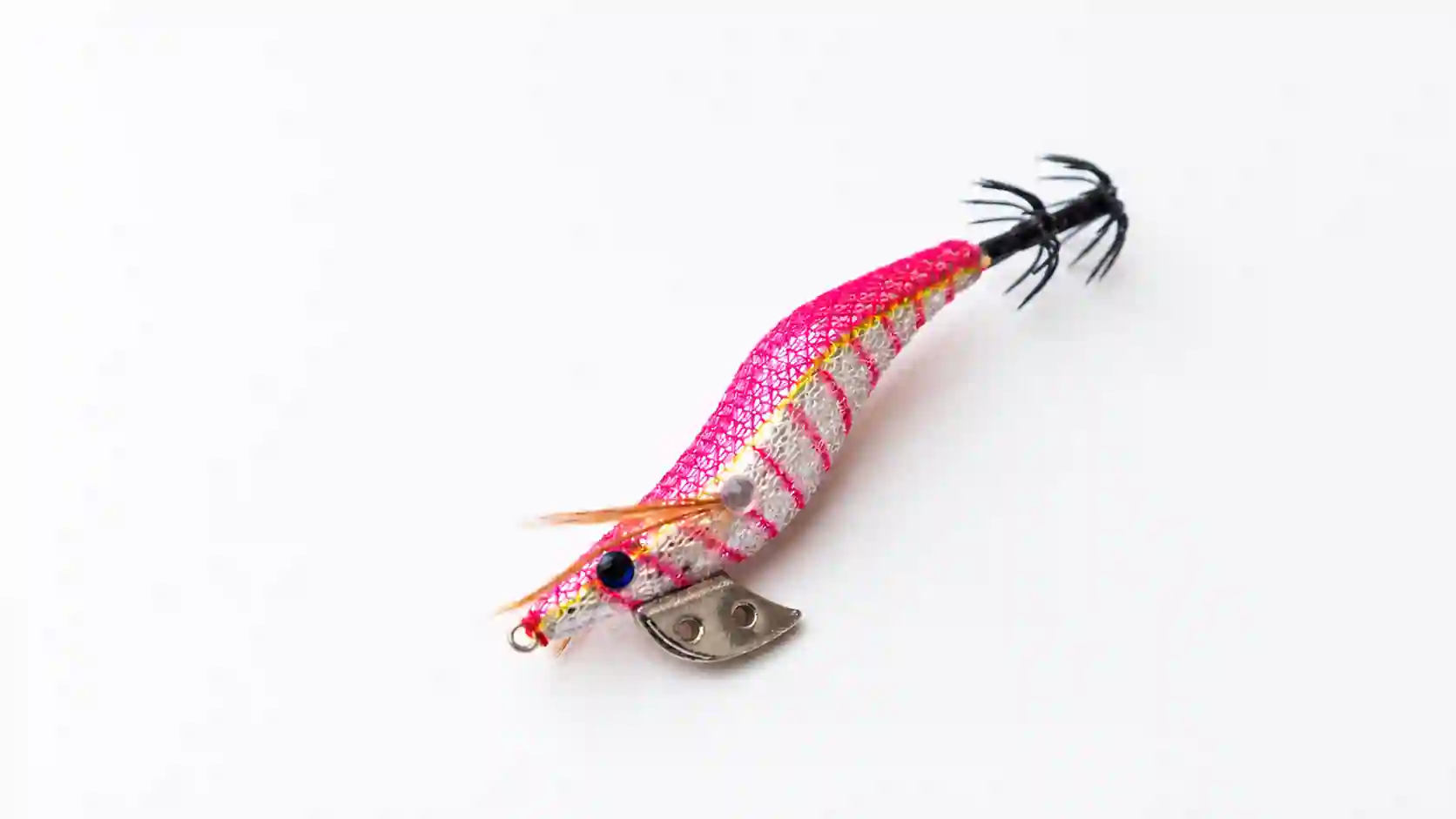 Pink calamariera squid jig on a white background.
