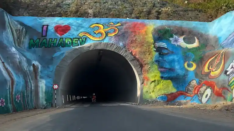 New Chandigarh to Manali highway tunnel with Mahadev mural.
