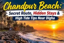 Protective boulders at Chandpur Beach during sunset with crashing waves near Digha.